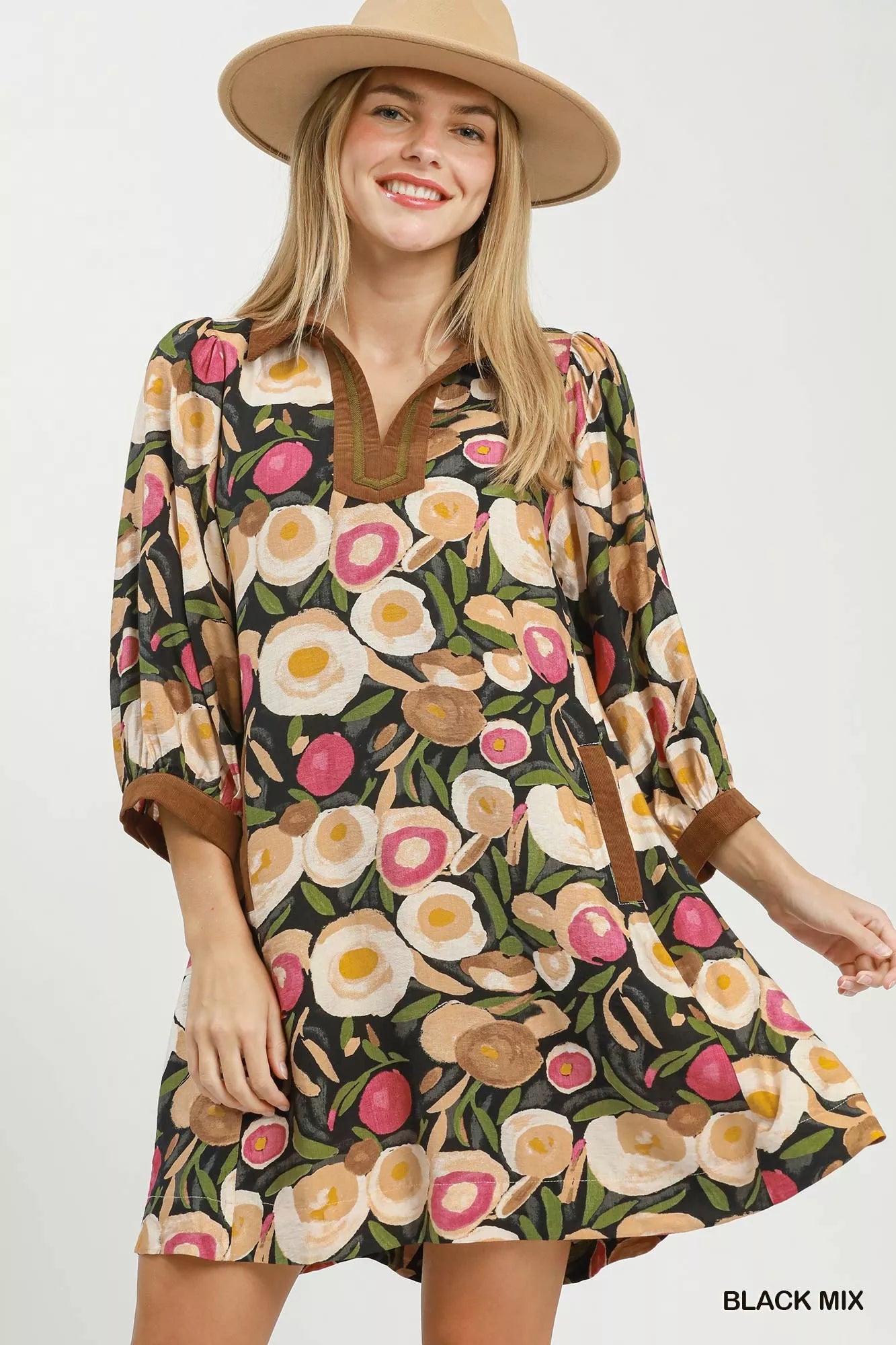 Black Umgee floral contrast trim shift mini dress with a relaxed fit, featuring a stylish floral pattern and casual summer style.