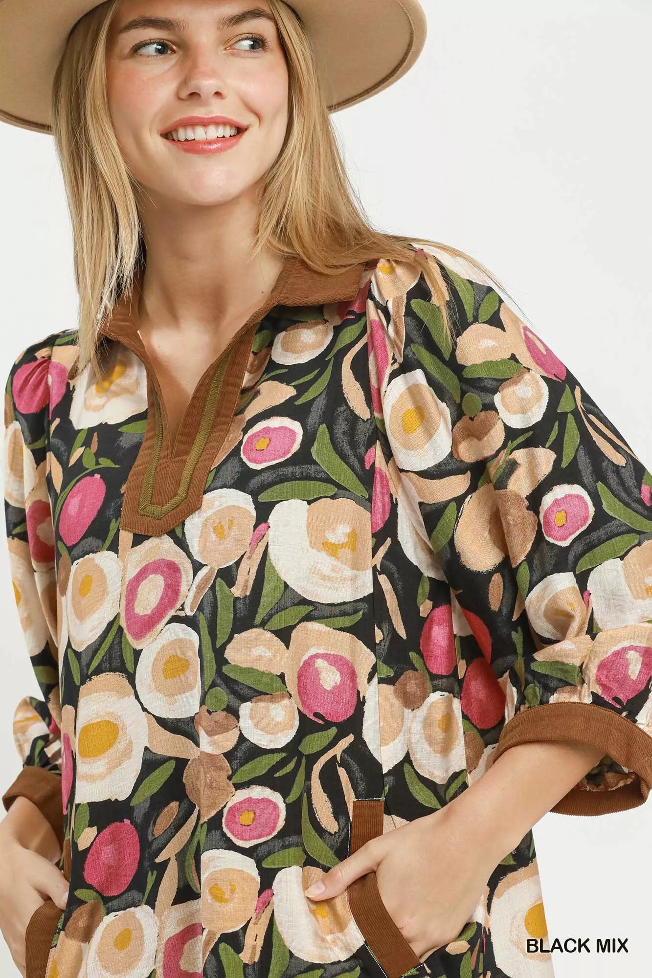 Black Umgee floral contrast trim shift mini dress with a relaxed fit, featuring mixed floral patterns and stylish trim details.