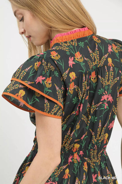 Black Umgee floral midi dress with a mixed floral pattern, flowing silhouette, and short sleeves.