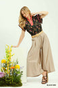 Black Umgee floral print blouse with contrast trim, featuring a relaxed fit and stylish design from Trendsi.