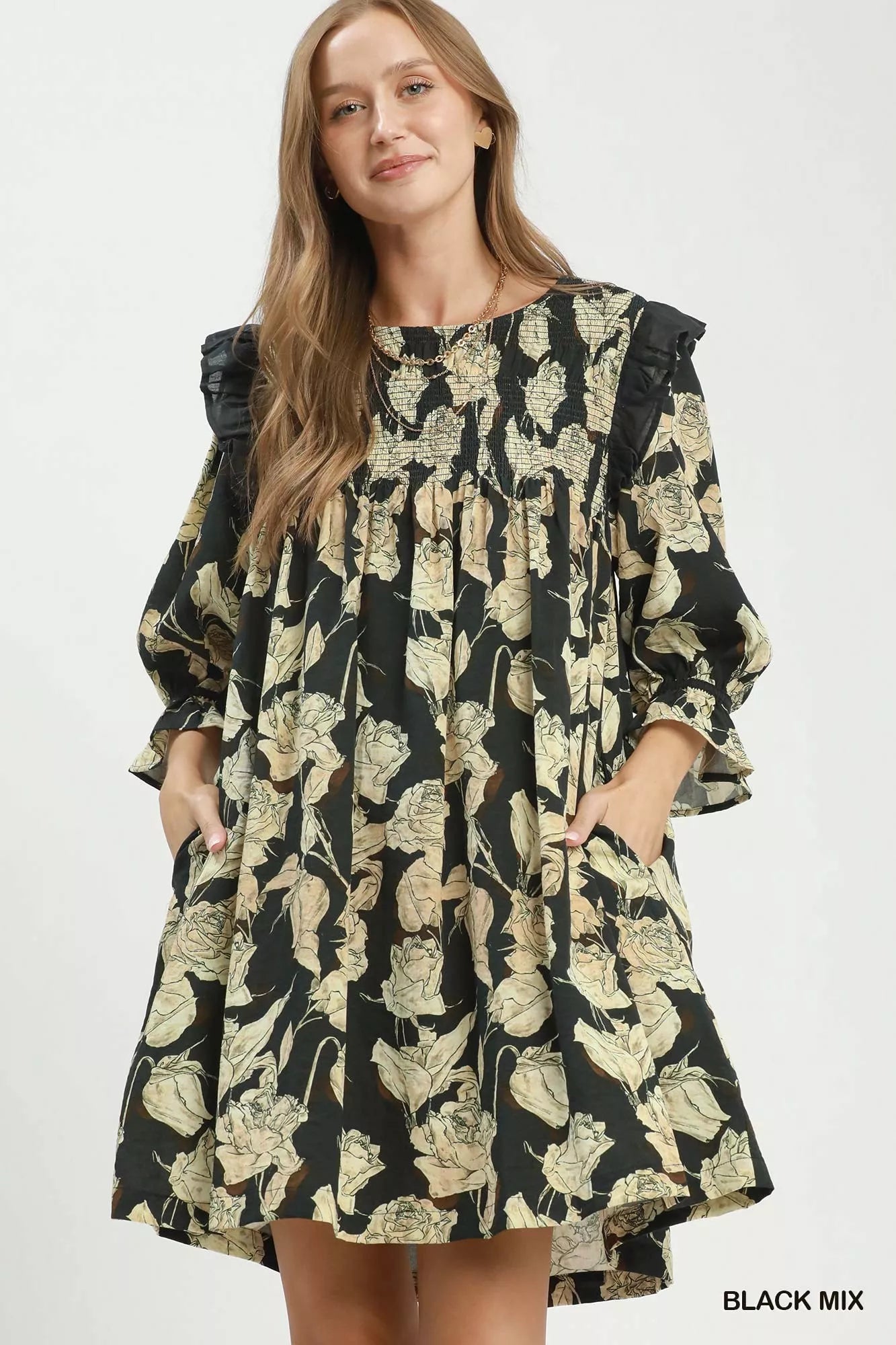 Black floral print flowy dress by Umgee with smocked bodice and ruffle details, perfect for casual or summer wear.