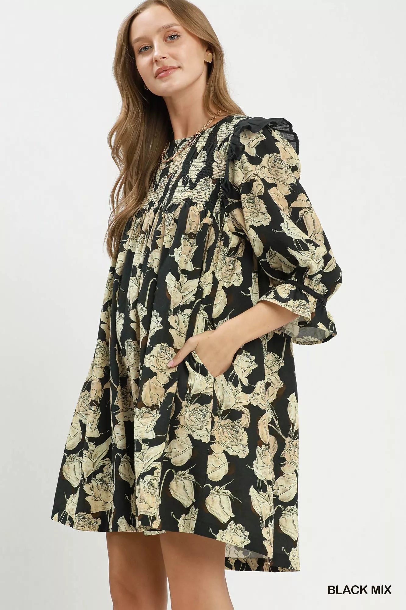Black floral print flowy dress by Umgee featuring smocked bodice and ruffle details, perfect for casual and spring wear.