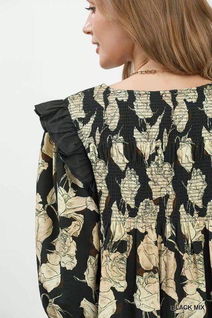 Black floral print flowy dress by Umgee with smocked bodice and ruffle details, perfect for casual and summer wear.