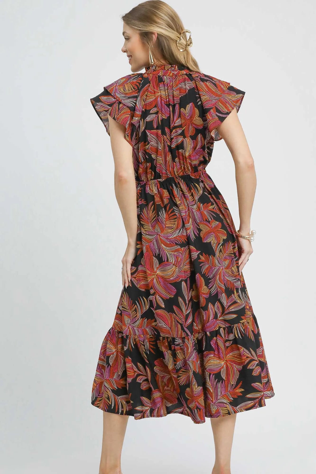Black Umgee tropical midi dress with ruffle sleeves, featuring a mix of vibrant tropical print and flowy silhouette.