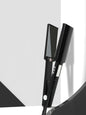 Black Trendsi fast heating hair straightener with North American plug, sleek design for smooth, straight hair styling.