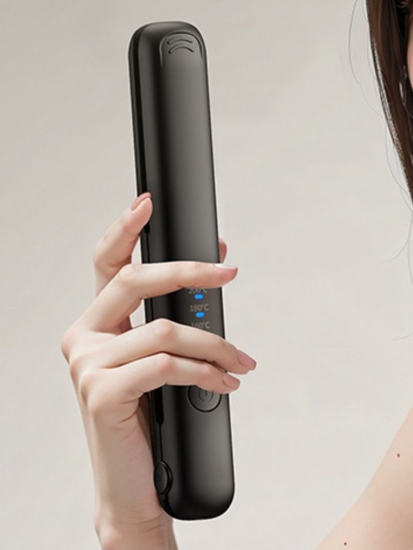 Black cordless rechargeable hair straightener by Trendsi with sleek design and compact size for easy styling on the go.