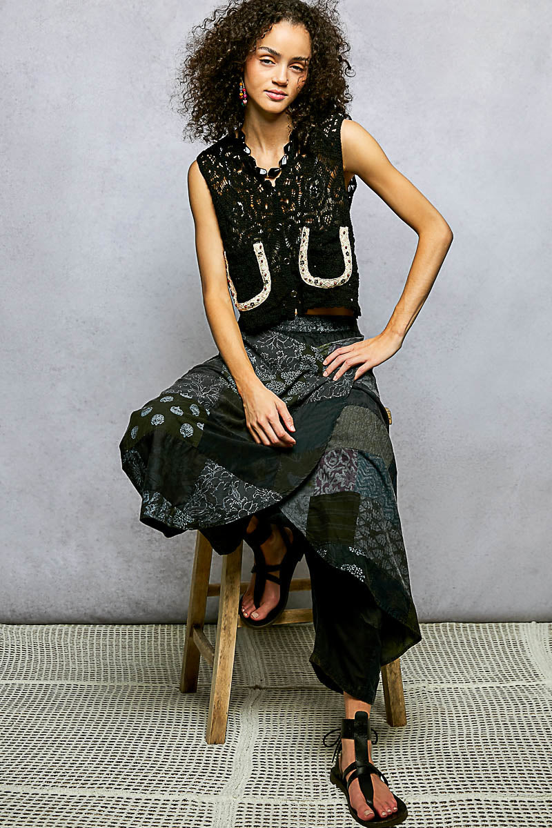Black POL button-down cropped crochet vest with scalloped edges, designed by Trendsi, shown on a neutral background.
