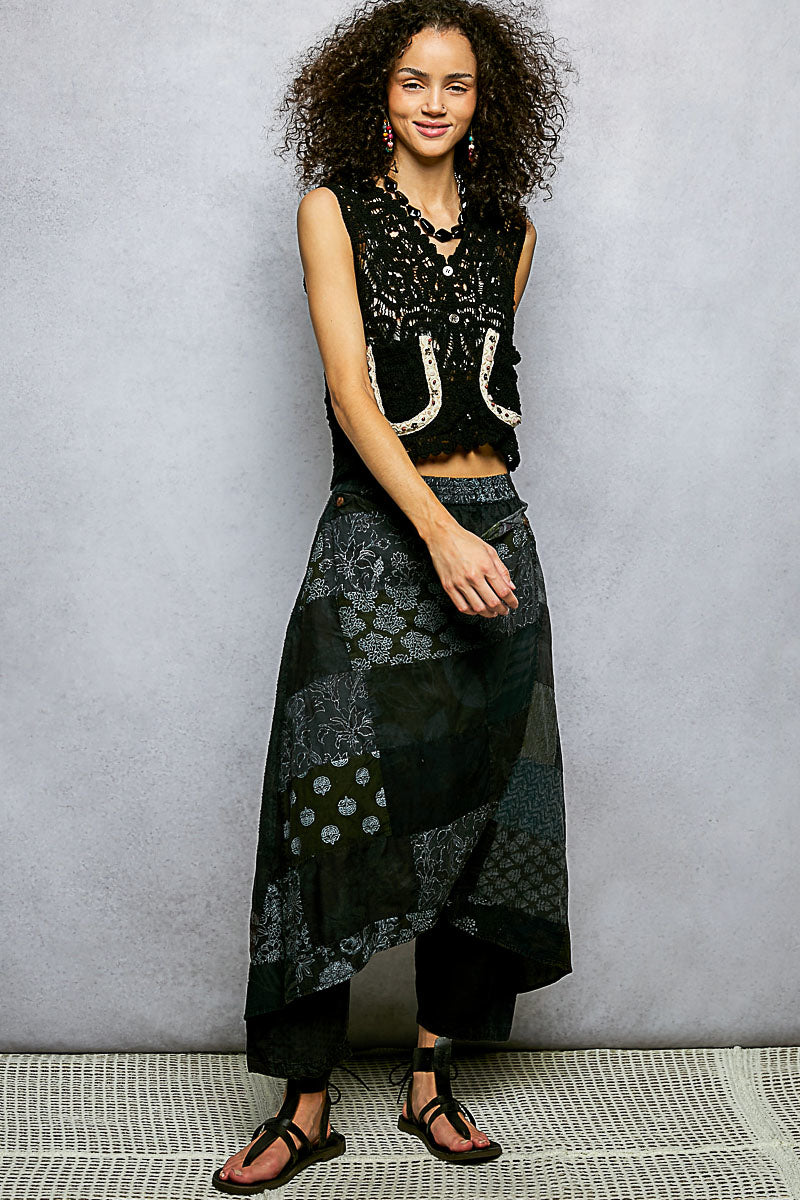 Black POL cropped crochet vest with scalloped edge, button-down style, from Trendsi, displayed on a neutral background.
