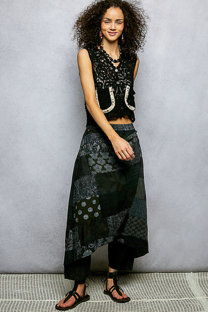 Black POL cropped crochet vest with scalloped edge, button-down style, from Trendsi, displayed on a neutral background.
