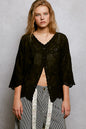 Black floral eyelet V-neck salloped shirt by Trendsi, showing detailed eyelet fabric and scalloped hem design.