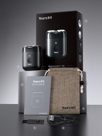 Black portable mini electric shaver by Trendsi with compact design and ergonomic handle for easy grooming.