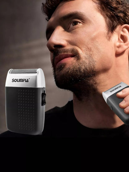 Black portable mini shaver by Trendsi, compact handheld device with a sleek design for easy grooming on the go.
