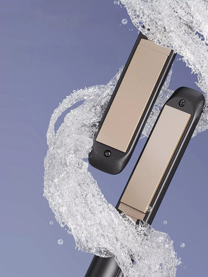 Black adjustable temperature hair straightener by Trendsi with a sleek design and ergonomic handle.