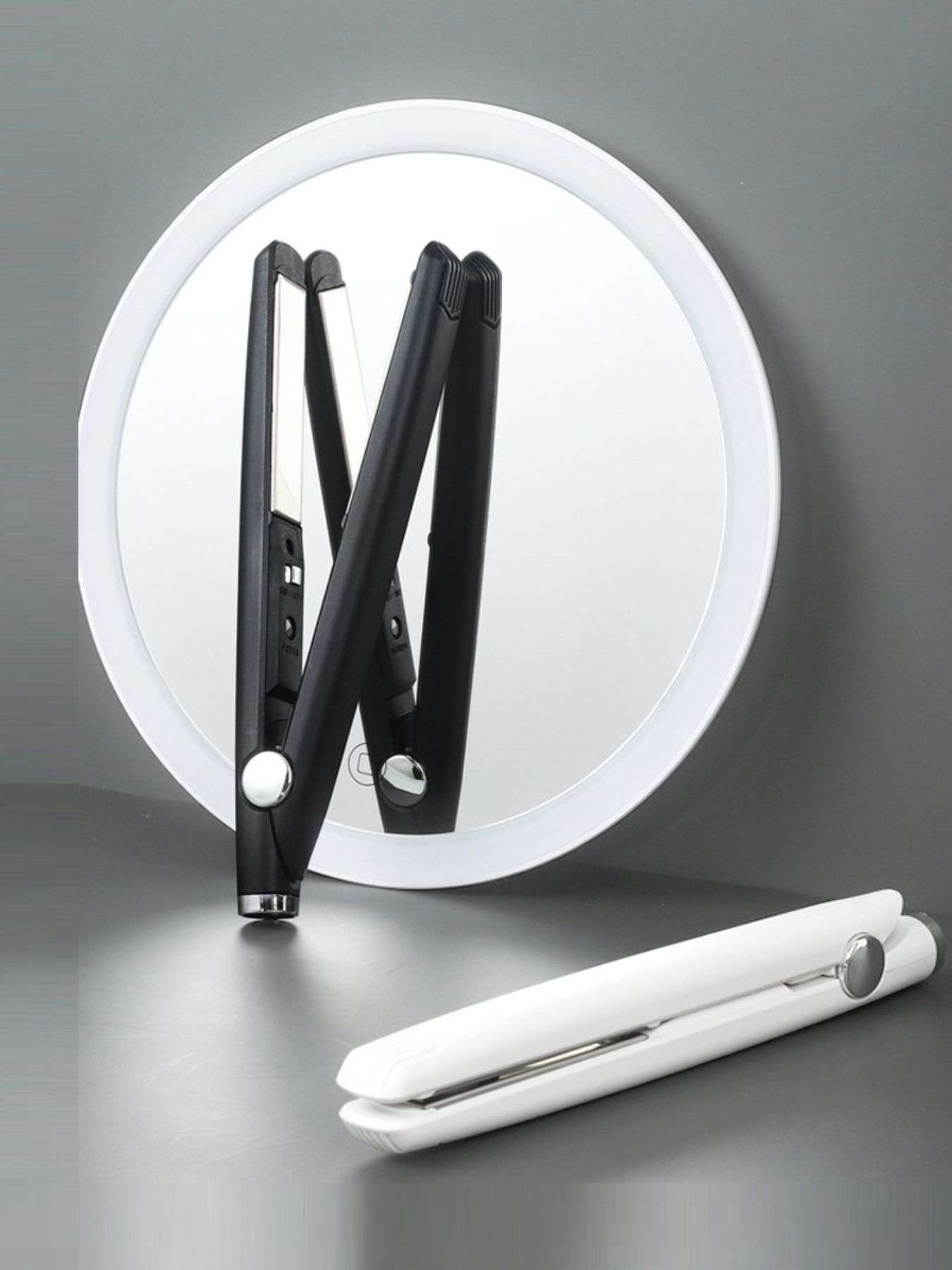 Black ceramic hair straightener from Trendsi with sleek design and ceramic plates for smooth, shiny hair styling.
