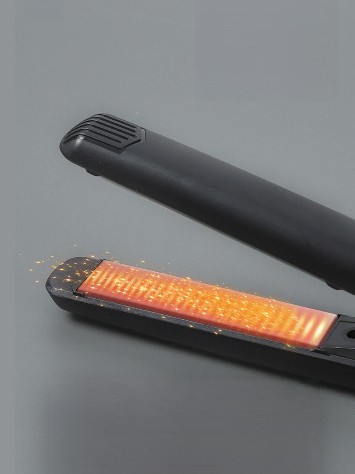 Black ceramic hair straightener from Trendsi with a sleek design, featuring ceramic plates for smooth styling.