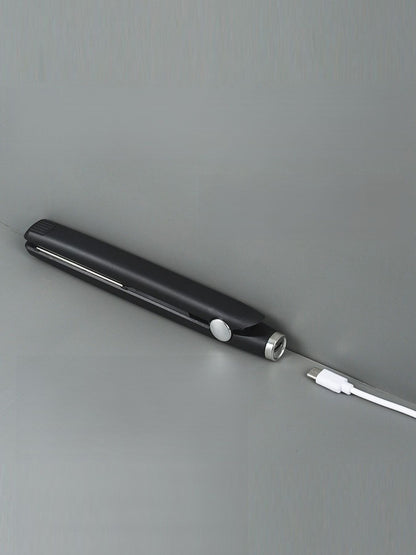 Black ceramic hair straightener from Trendsi, featuring a sleek design and ceramic plates for smooth, frizz-free styling.