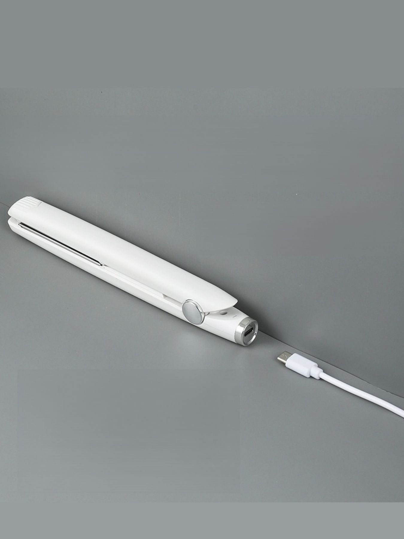 Black ceramic hair straightener from Trendsi, with sleek design and ceramic plates for smooth, shiny hair styling.