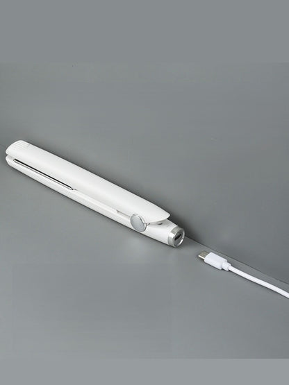 Black ceramic hair straightener from Trendsi, with sleek design and ceramic plates for smooth, shiny hair styling.