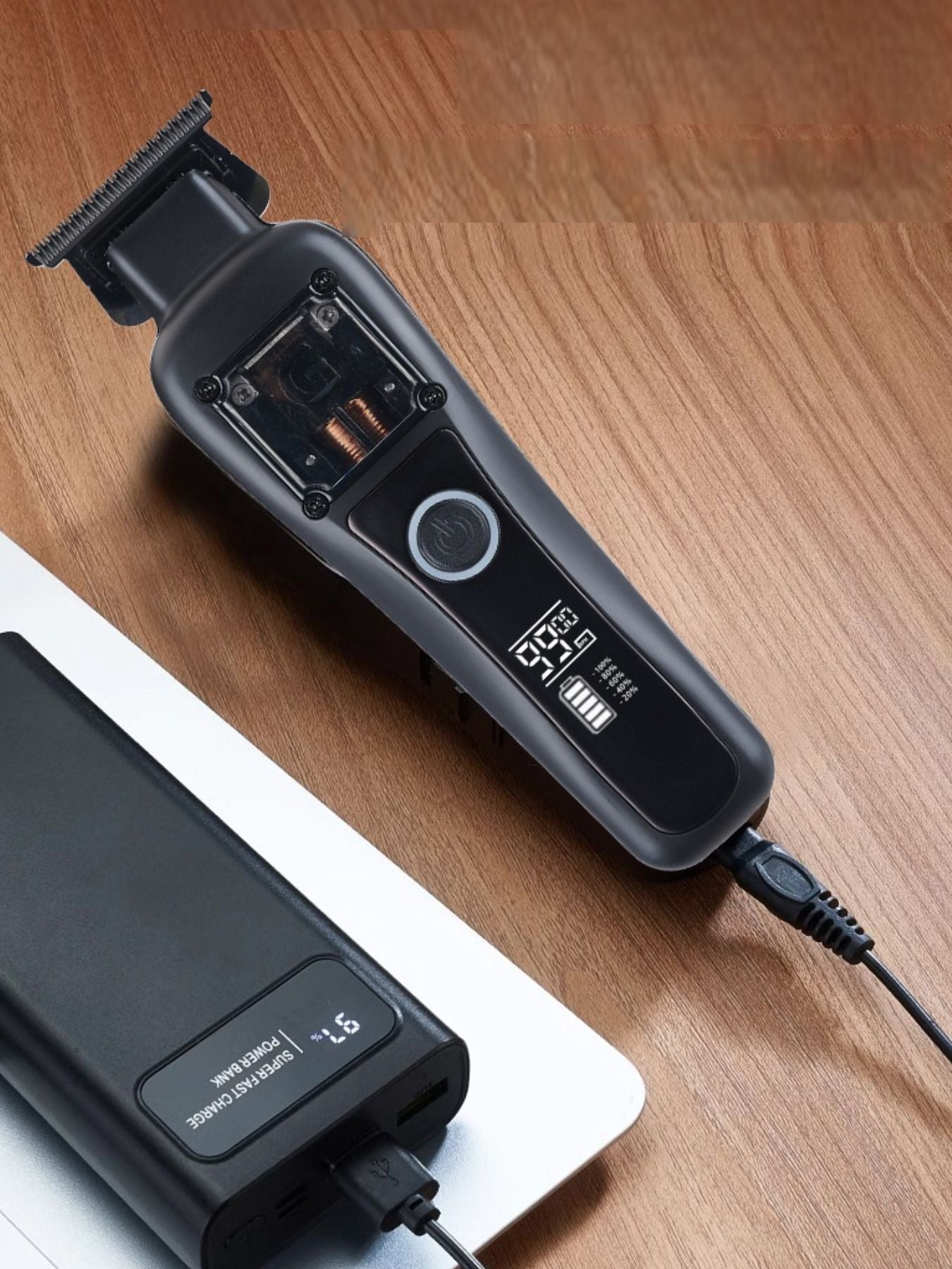 Black cordless hair clipper from Trendsi with adjustable blades and ergonomic design for easy hair trimming.