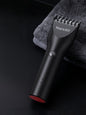 Black Trendsi cordless hair clipper with adjustable blades and ergonomic design for easy hair cutting.