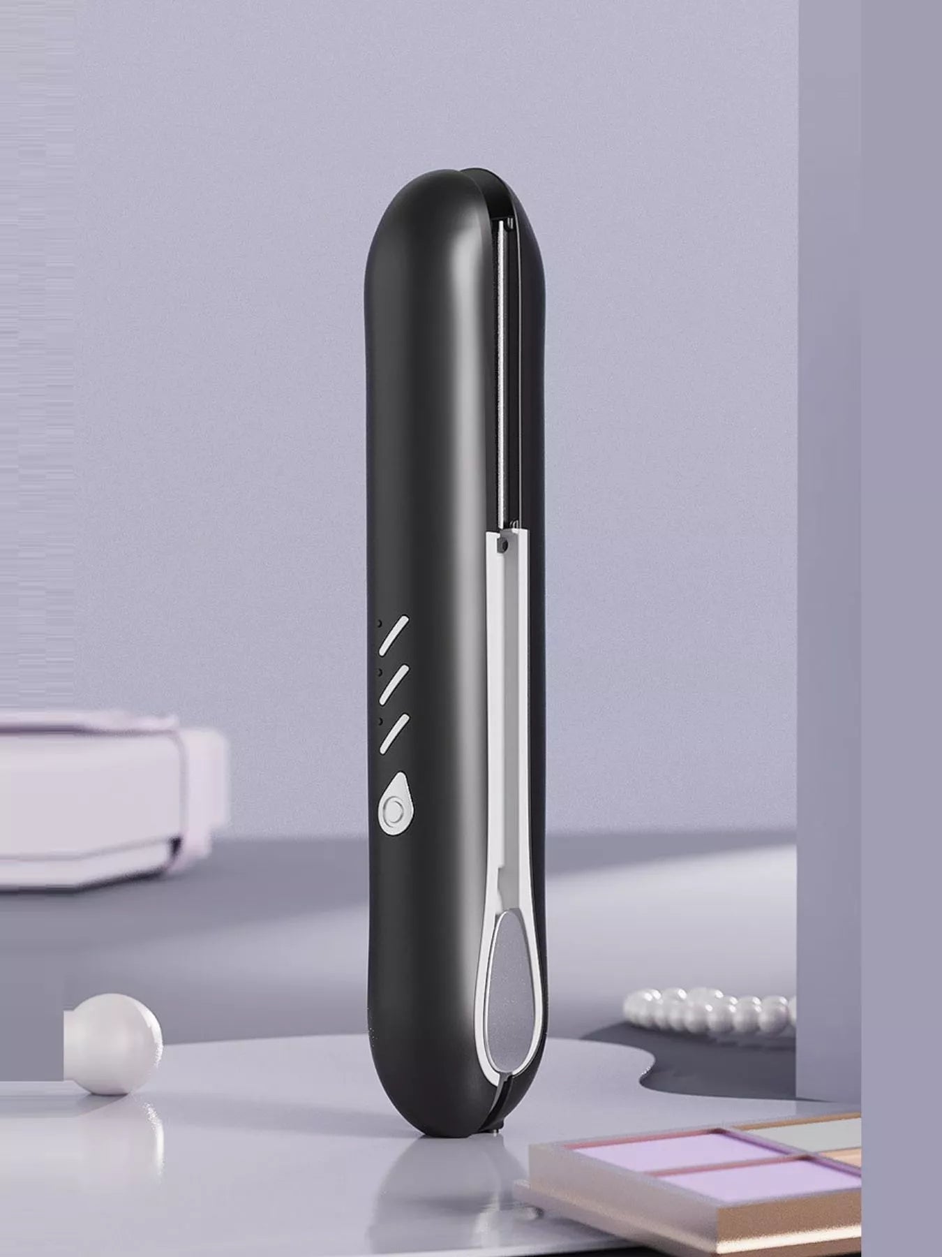 Black cordless rechargeable hair straightener by Trendsi with sleek design and ceramic plates for smooth, straight hair.