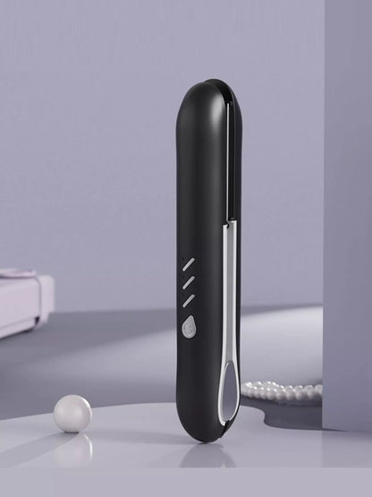 Black cordless rechargeable hair straightener by Trendsi with a sleek design, perfect for quick styling on the go.