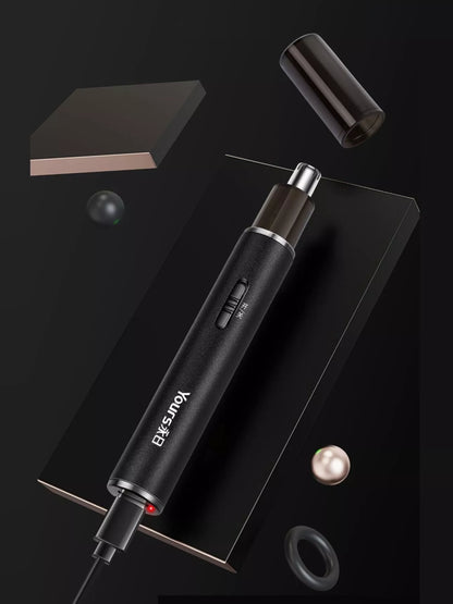 Black electric nose hair trimmer by Trendsi with a compact design, ideal for grooming nose and ear hair effectively.