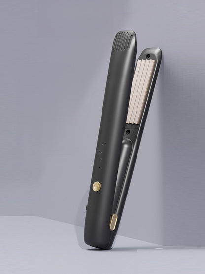 Black Trendsi fast heating hair straightener with sleek design and ceramic plates for smooth, straight hair.