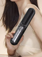 Black heated hair straightening comb by Trendsi, with wide teeth for easy styling and smooth, shiny hair.