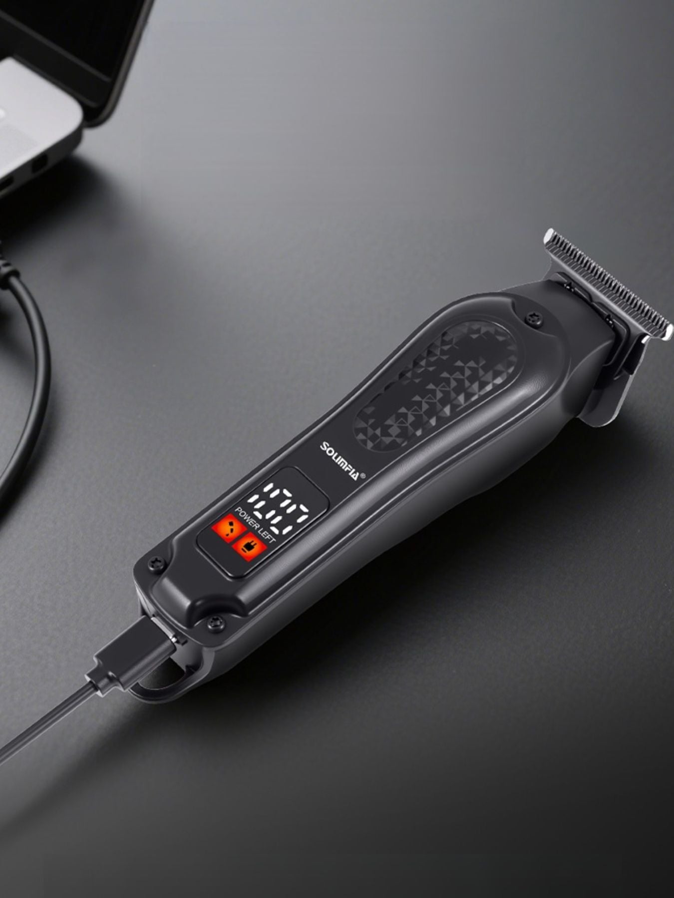 Black cordless hair clipper with LED display from Trendsi, featuring a sleek design and adjustable blades for precise haircutting.