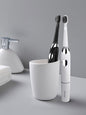 Black electric toothbrush with long battery life from Trendsi, featuring a sleek design and one-size-fits-all brushing head.