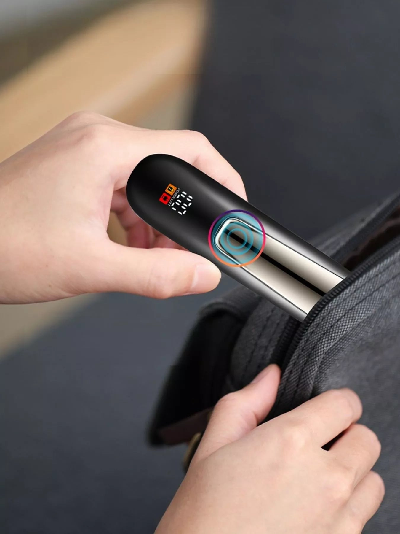 Black men's waterproof electric trimmer with LCD display and dock charging from Trendsi, showing the trimmer and charging station.