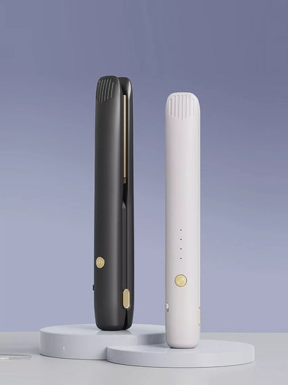 Black portable hair straightener from Trendsi, compact and lightweight for easy styling on the go.