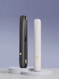 Black portable hair straightener from Trendsi, compact and lightweight for easy styling on the go.