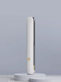Black portable hair straightener from Trendsi with a sleek design, ideal for quick styling on the go.