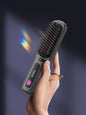 Black portable heated hair straightening comb by Trendsi, compact design with heated ceramic plates for easy styling.