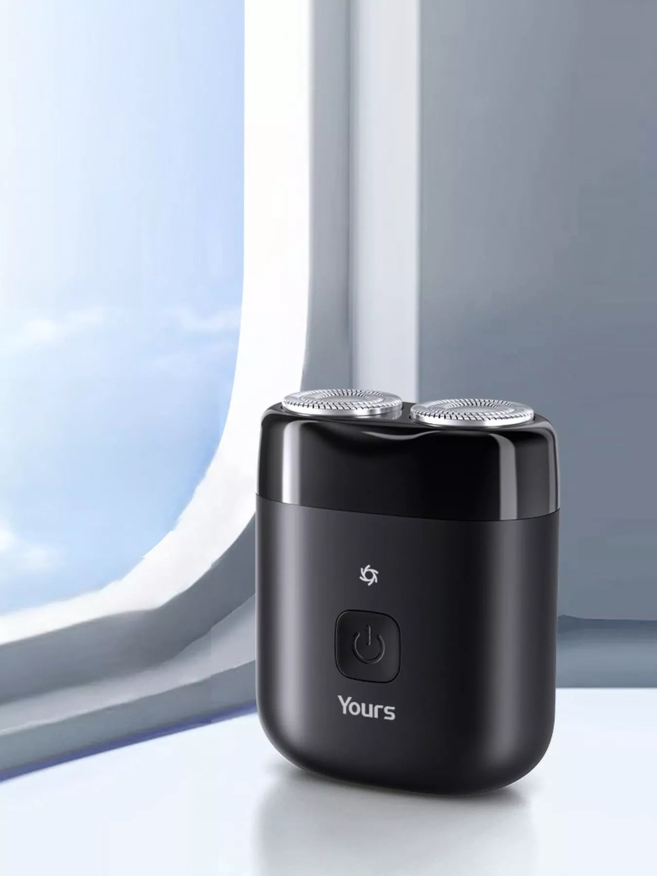 Black portable mini electric shaver by Trendsi with compact design, ideal for on-the-go grooming and quick facial hair trimming.