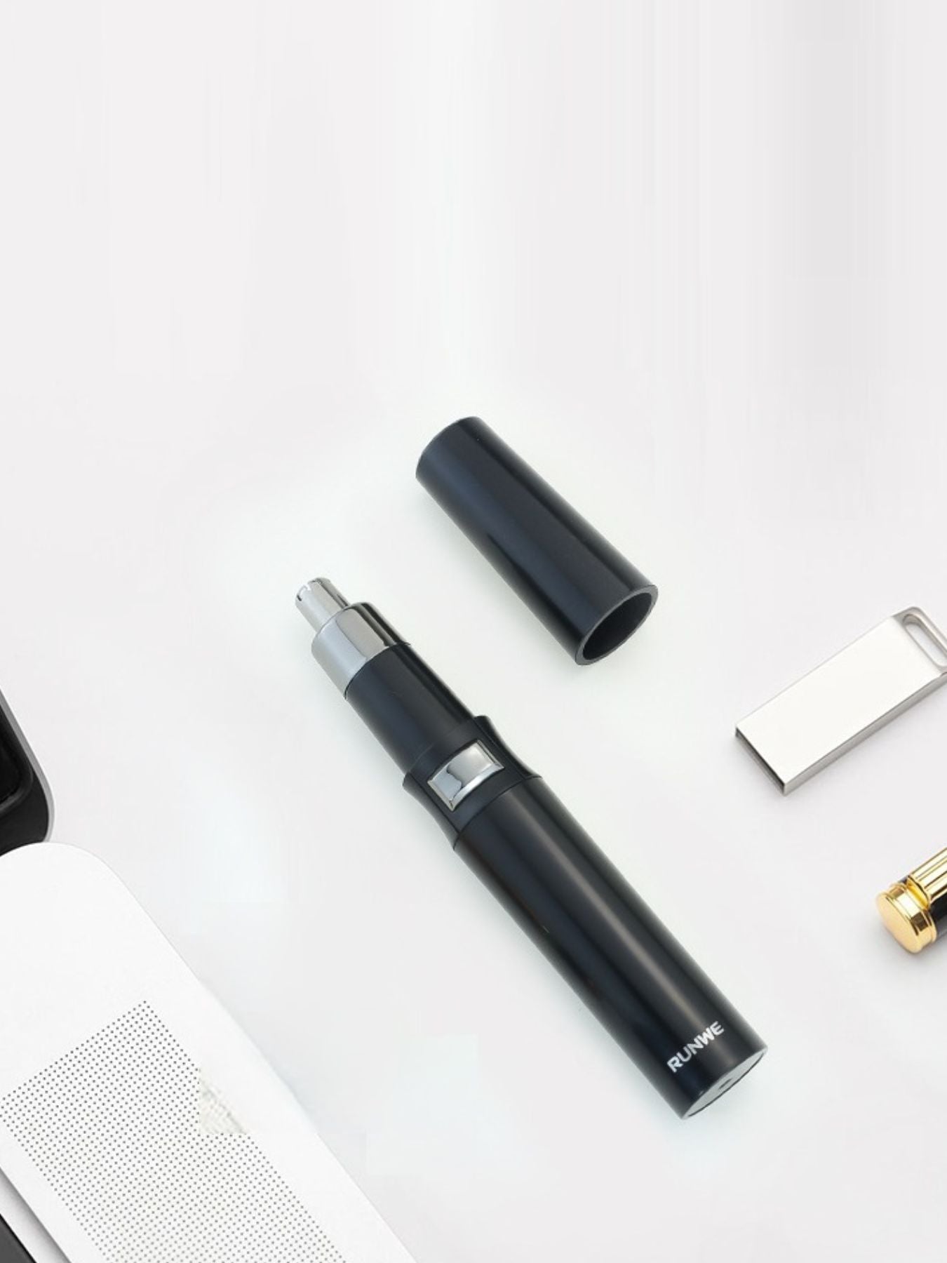 Black portable nose hair trimmer by Trendsi with a compact design, ideal for easy grooming and personal care.