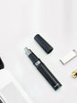 Black portable nose hair trimmer by Trendsi with a compact design, ideal for easy grooming and personal care.