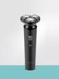 Black rechargeable 3-head rotary shaver from Trendsi with a sleek design and ergonomic handle for a smooth shave.