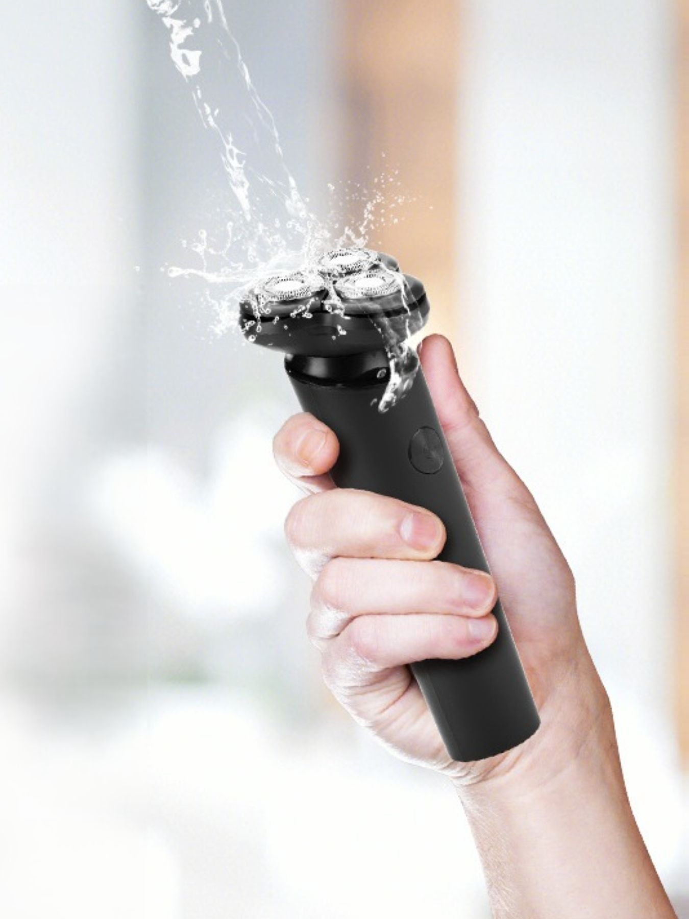 Black rechargeable 3-head rotary shaver by Trendsi with a sleek design and ergonomic handle for smooth shaving.