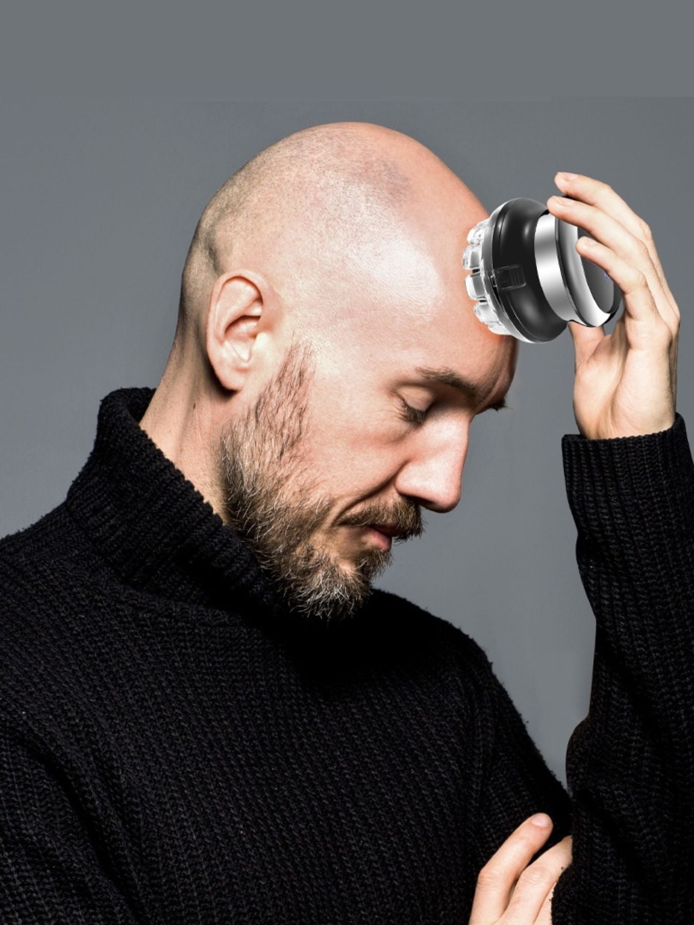 Black rechargeable bald head hair clipper from Trendsi with a sleek design, suitable for precise head shaving.