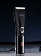 Black rechargeable hair clipper from Trendsi with adjustable blades and ergonomic design for easy grooming.