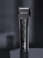 Black rechargeable hair clipper by Trendsi with adjustable blades and ergonomic design for easy grooming.