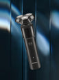 Black rechargeable rotary shaver from Trendsi with a sleek design, suitable for close grooming and easy handling.