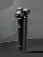 Black Trendsi rotary electric shaver with a sleek design, featuring multiple rotary blades for close, smooth shaving.