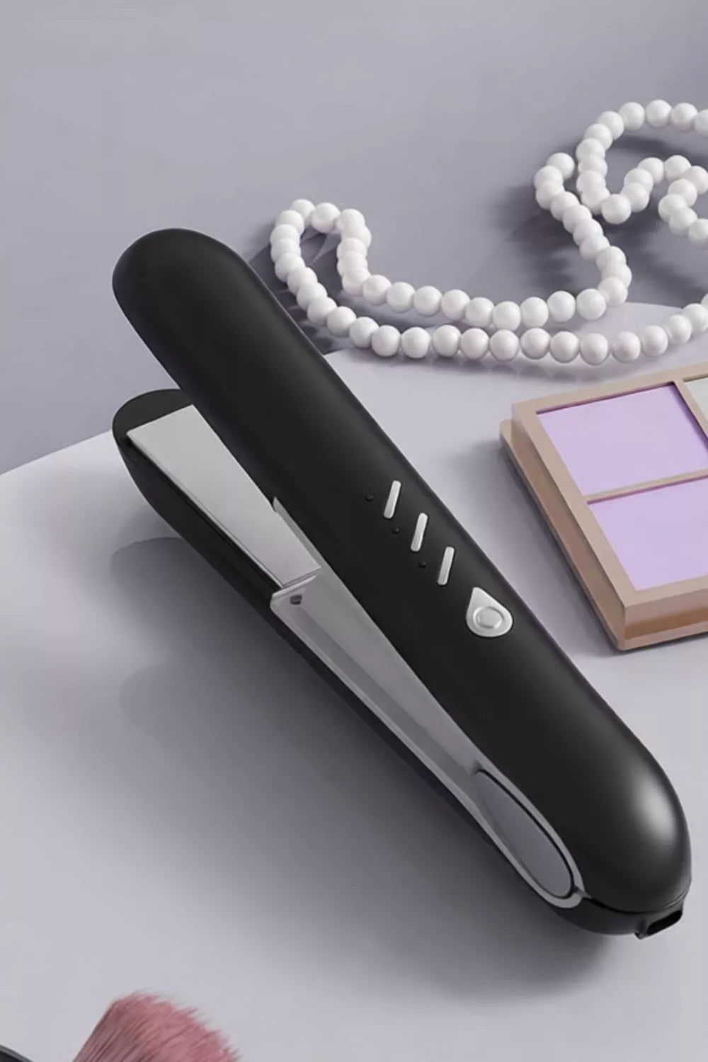 Black Trendsi temperature control hair straightener with adjustable settings and sleek design, ideal for smooth, straight hair.