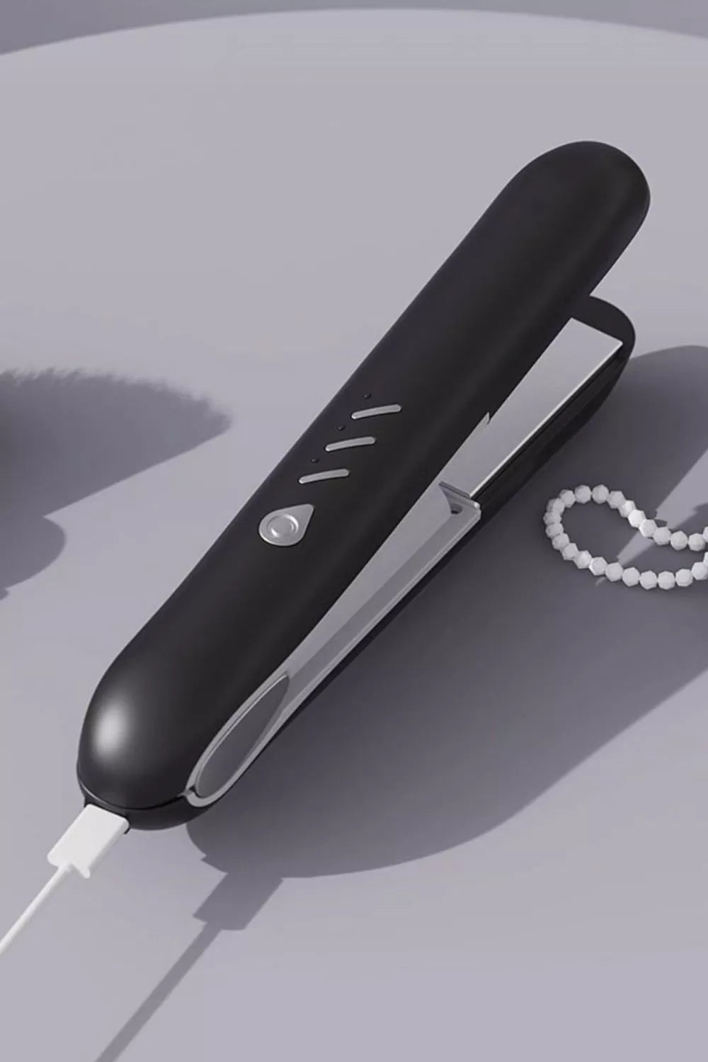 Black Trendsi temperature control hair straightener with adjustable heat settings and sleek design.