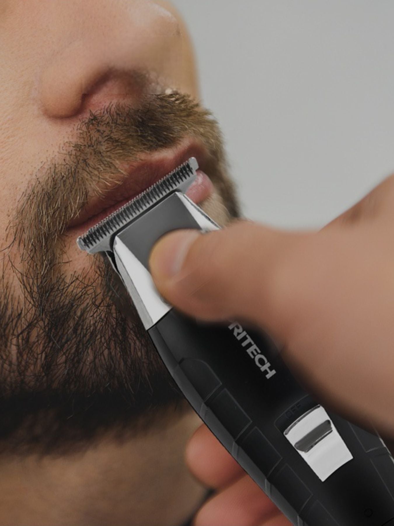 Black waterproof cordless hair clipper from Trendsi with ergonomic design and adjustable blades for versatile styling.