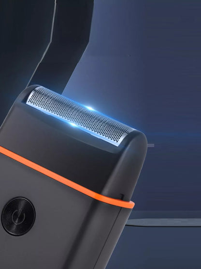 Black and orange Trendsi portable mini shaver with a compact design, ideal for on-the-go grooming.
